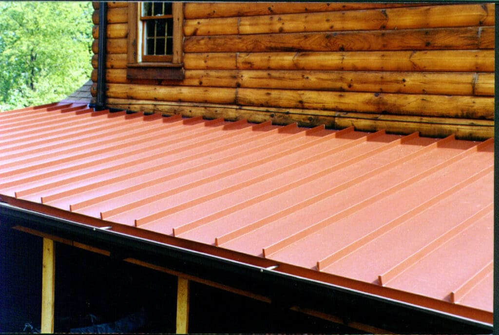 Red Standing Seam Metal Roof Awning on wood finished house