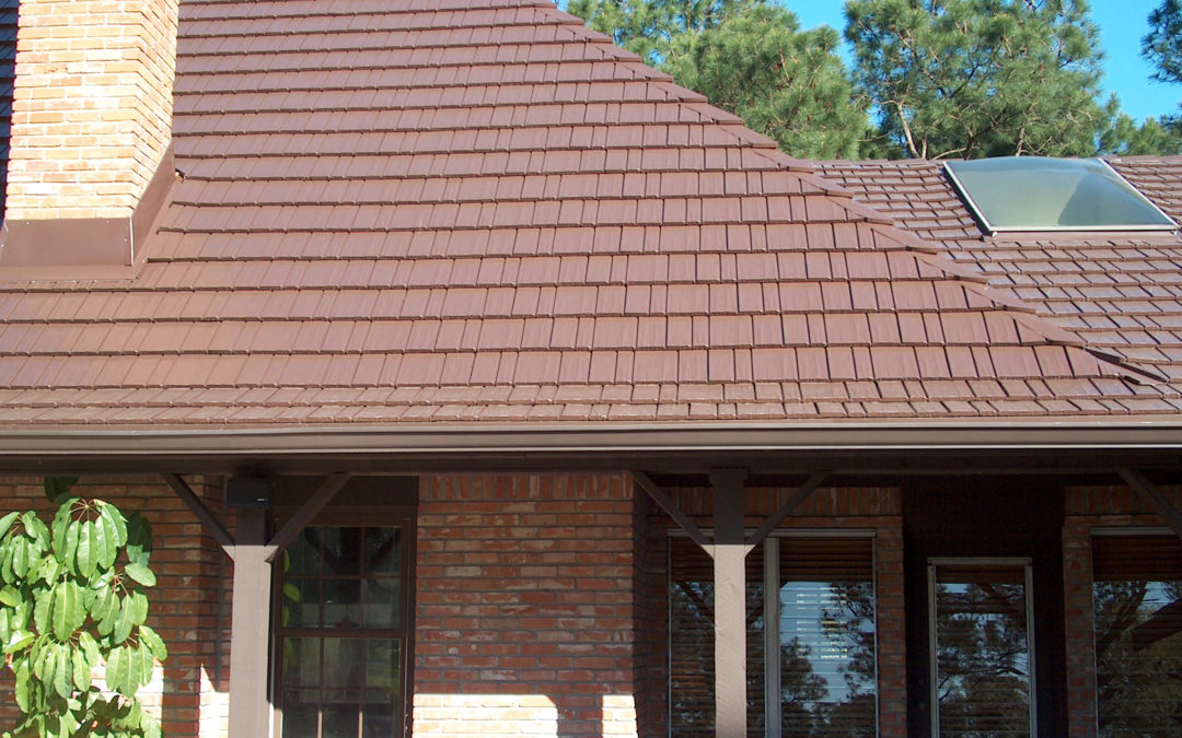 Close up of Terra Red Cedar Shake Metal Roof on brick house in Portland, OR, to illustrate metal roof types residential
