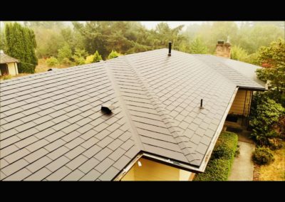 Close up view of a composite shingle metal roof