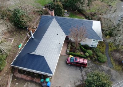 Aerial view of smooth black shingles metal roof in Portland, OR