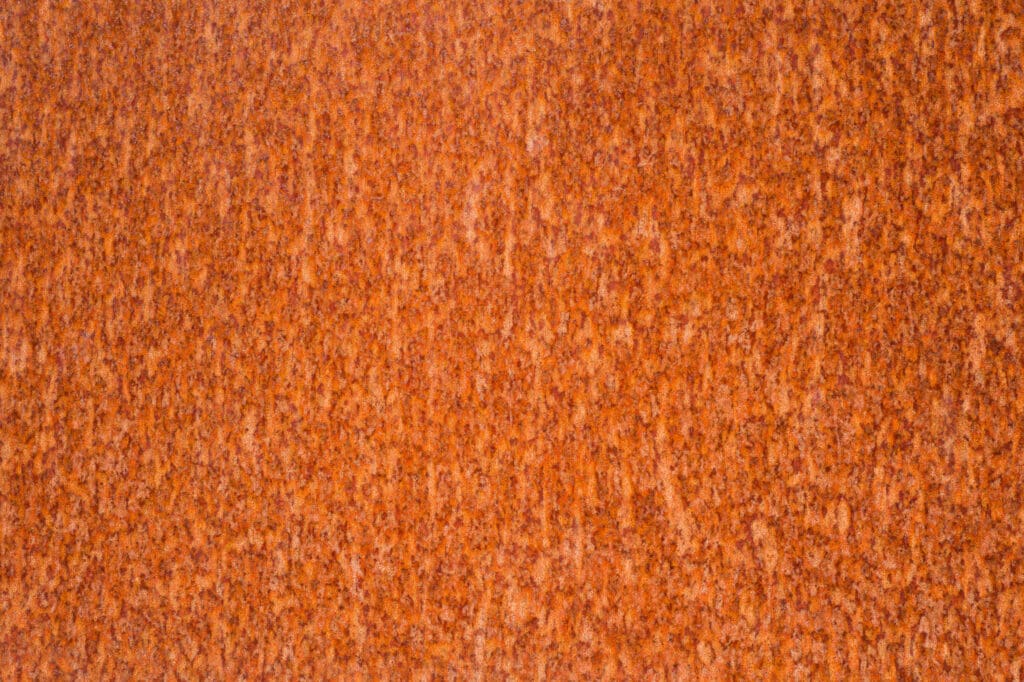 Rust spots on a steel plate to illustrate Do Metal Roofs