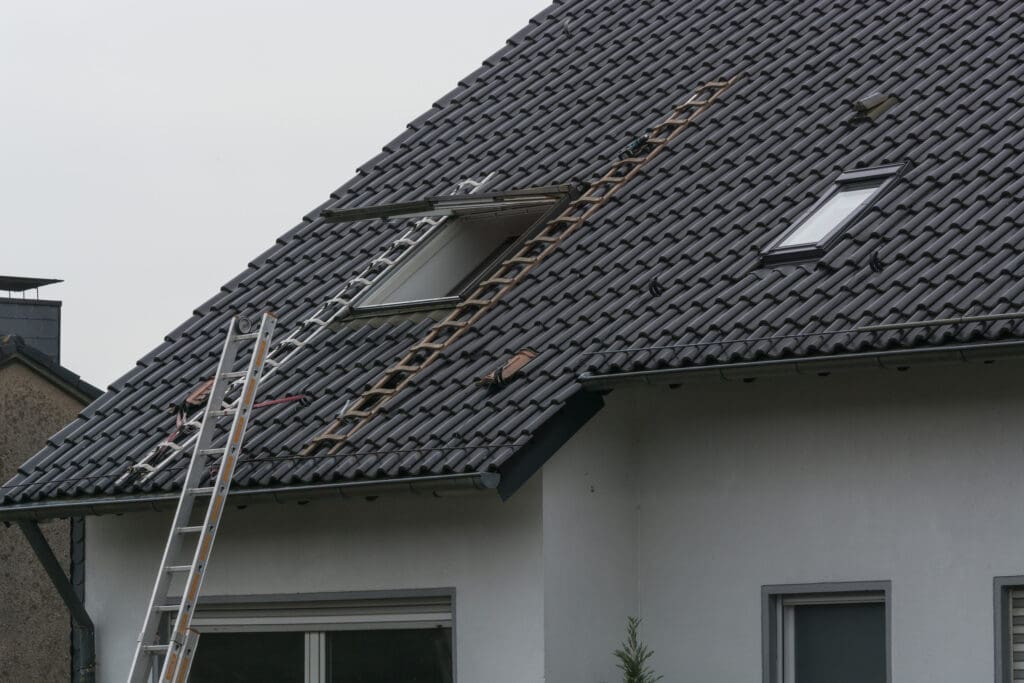 Roofing contractor builds metal roof with skylights to illustrate skylights for metal roofs.