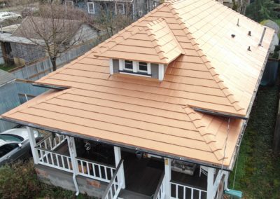 Copper Penny Oxford Shingle on a Portland, OR, home to help illustrate how long do copper roofs last