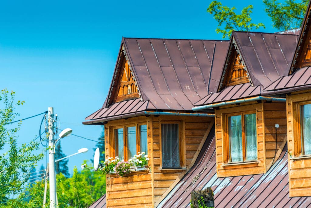 rural house close-up elements - top floor, windows and to illustrate Metal Roof On Old House