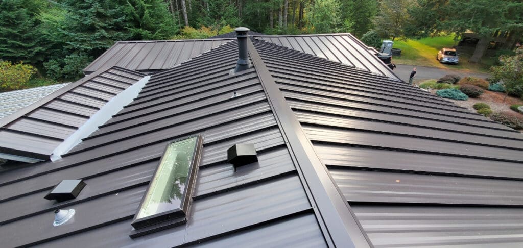 A metal roof with skylight and vents to illustrate does a metal roof increase home value.