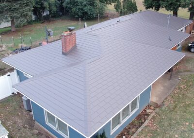 Tudor Brown Woodgrain Embossed Aluminum Shingle - Salem, OR - to help illustrate the best aluminum roof coating.