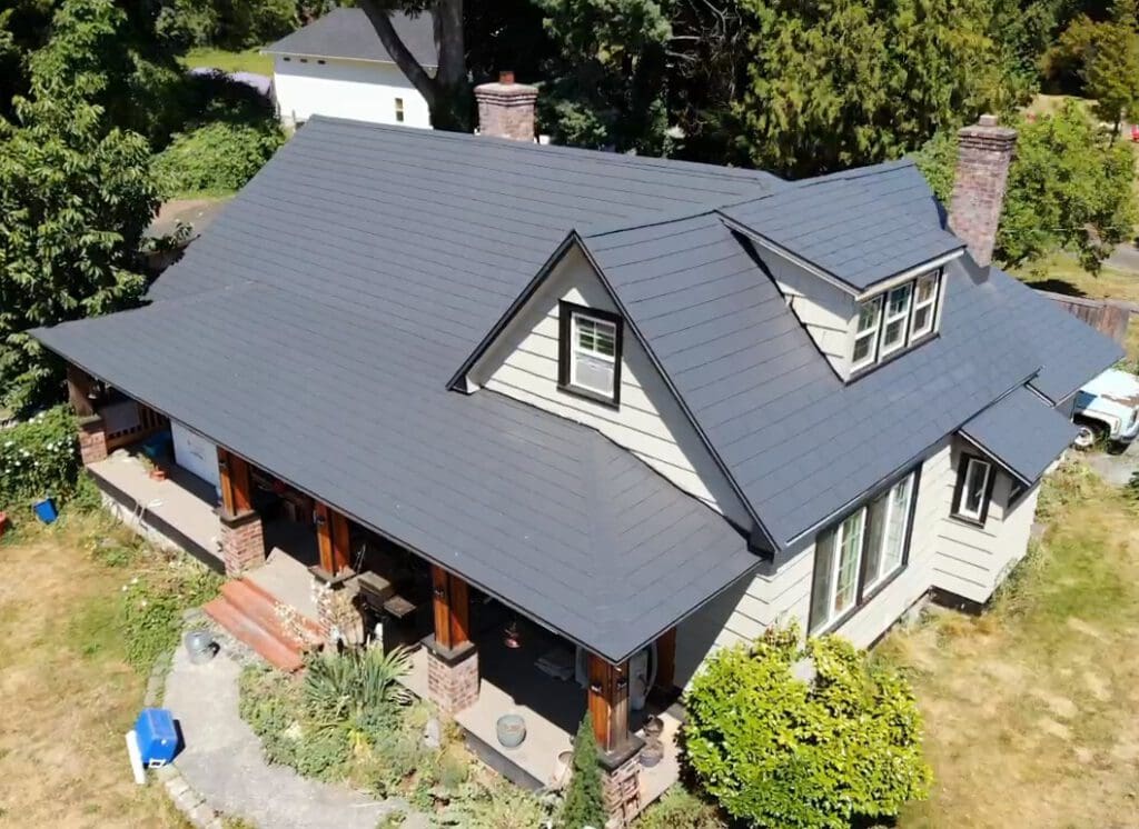 A nice home with Charcoal Grey Embossed metal roofing to illustrate how long does metal roofing last.