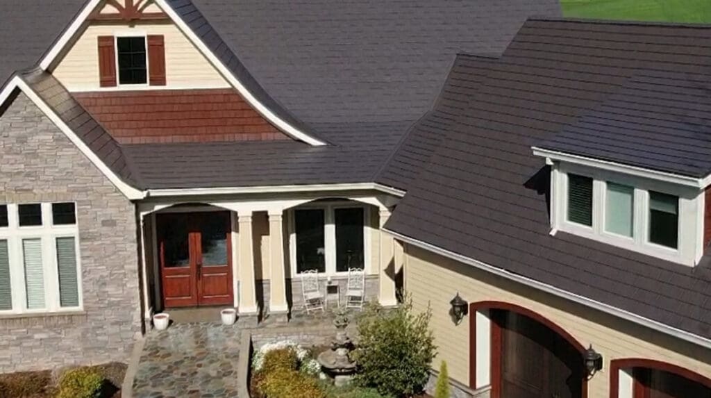 A beautiful home with brown metal roof to illustrate how to install gutters on a metal roof.