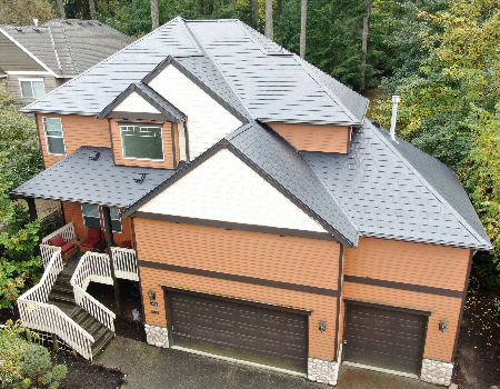 Black Woodgrain Embossed Shingle roof with lighter orange siding and brown trim with white accents in Portland, OR, to illustrate metal roof and siding color combinations.