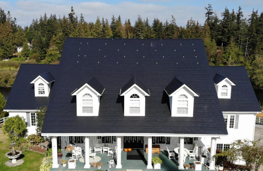 Black Slate Aluminum Shingle omn a home to illustrate types of metal roofs for homes.