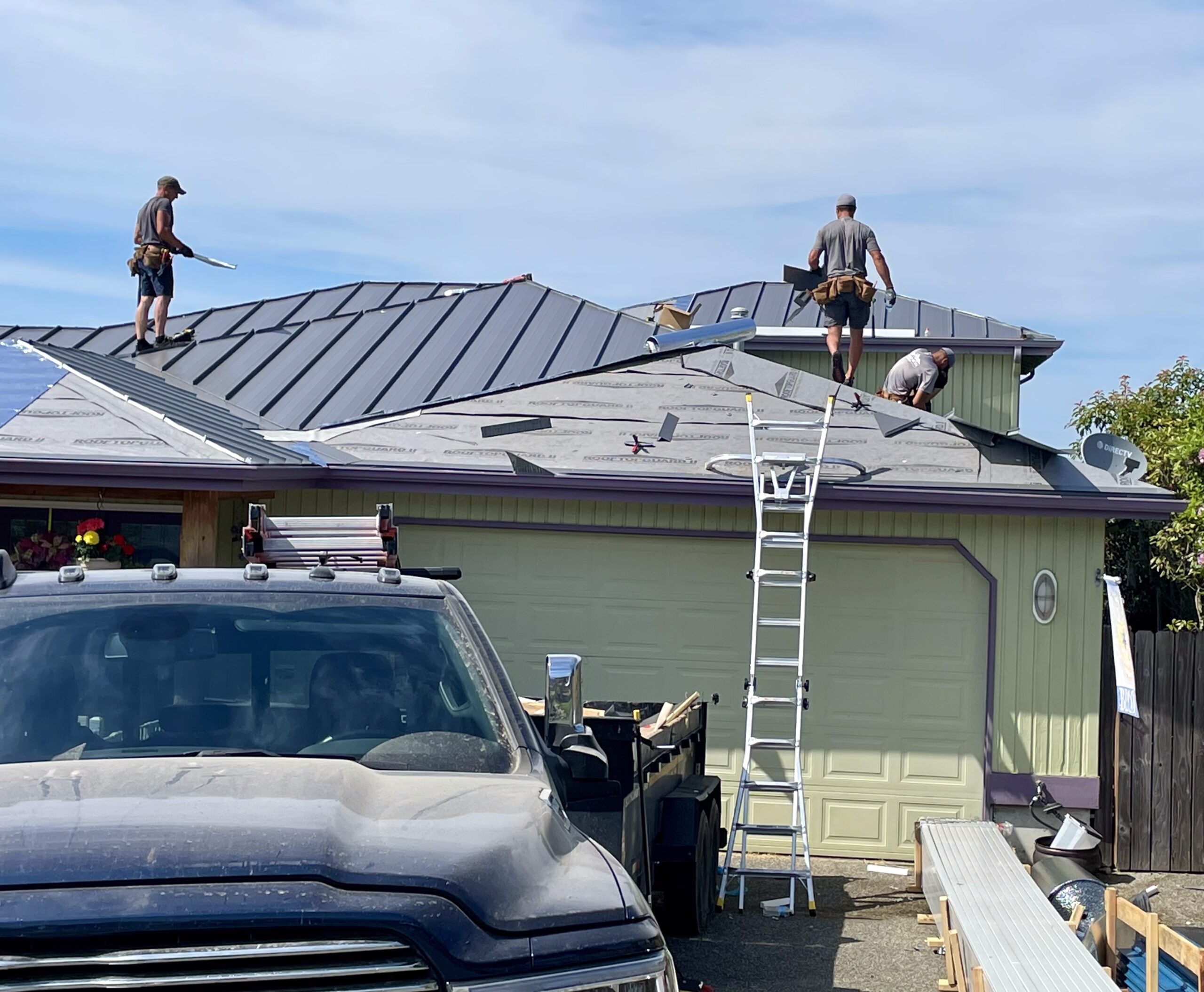 The Mountaintop Metal Roofing crew working on a new metal roof installation