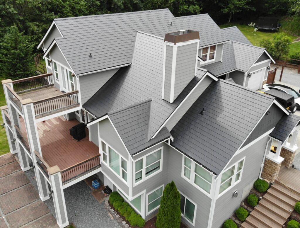 Black Slate Aluminum Shingle installed on a beautiful gray house in Buckley, WA. Picture taken from above.